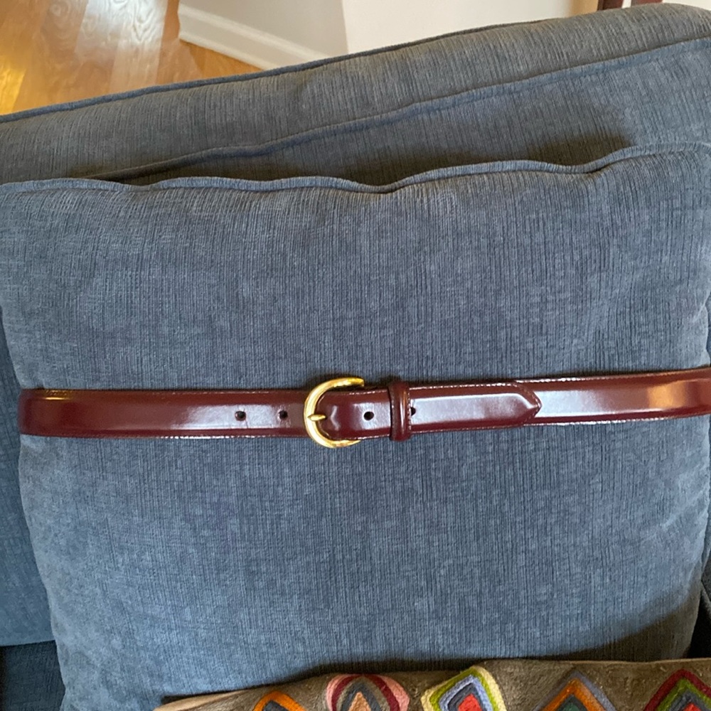 Men’s Coach brand cordovan leather belt, 42” waist